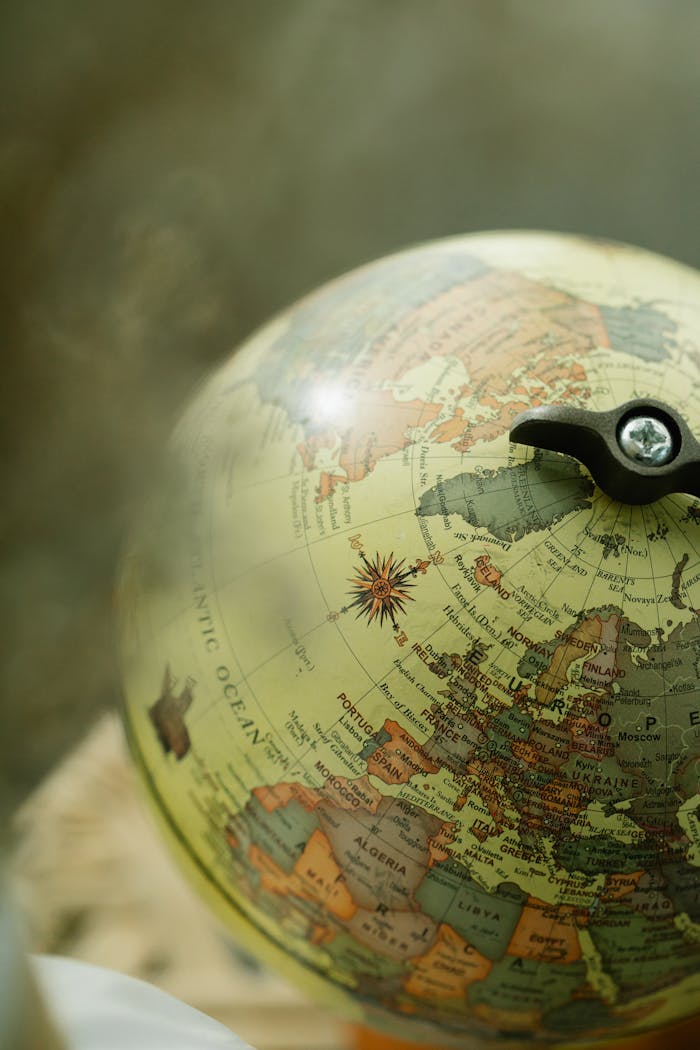 about-us-02 A vintage globe displaying Europe and Africa, capturing geographic details with a nostalgic vibe.